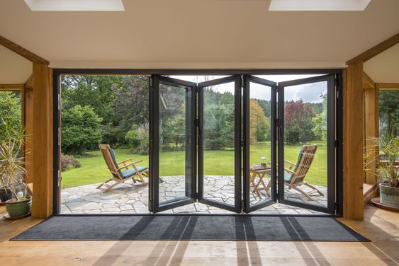 Elevate your Space with Ravi Double Glazing Ltd's High-Quality Bifold Doors.
